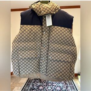 Men's Gucci, GG Supreme canvas down vest in beige and navy size 62.
4XL
